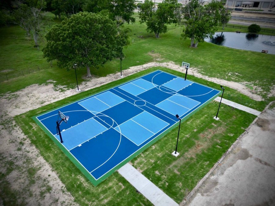 Two-tone blue combo court with basketball and pickleball lines