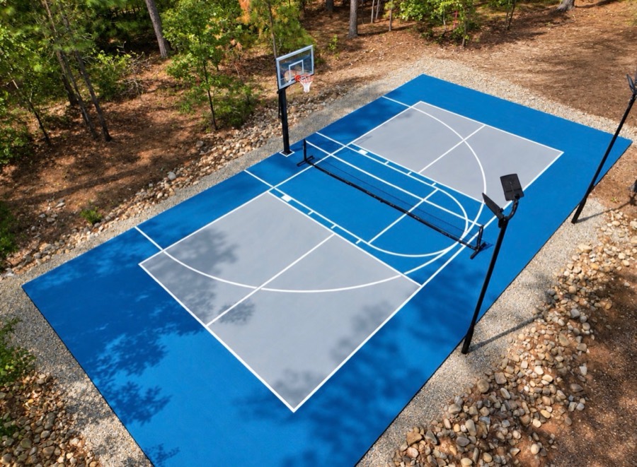Blue and gray basketball half court with lighting